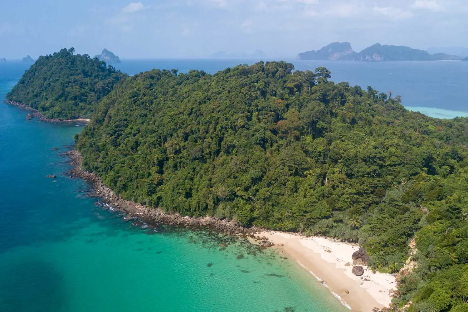Empty Ko Kradan beach with jungle